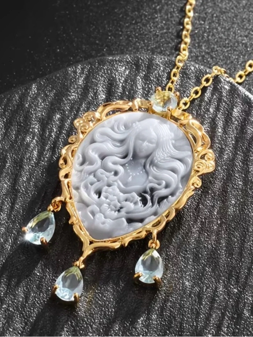 Gold Cameo Pendant Necklace with Gray Cameo and Light Blue Gem Drops